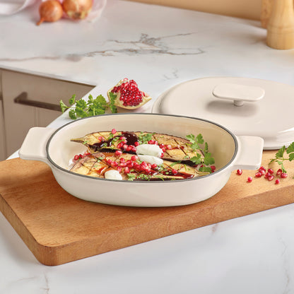 Enamelled cast iron oval casserole with lid - cream