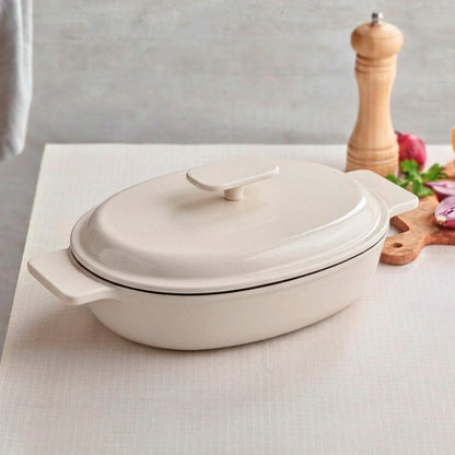 Enamelled cast iron oval casserole with lid - cream