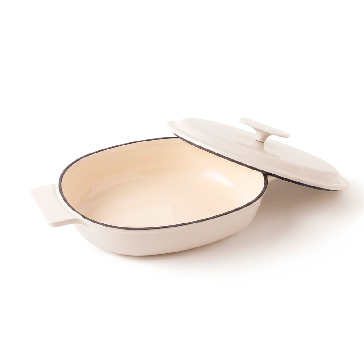 Enamelled cast iron oval casserole with lid - cream