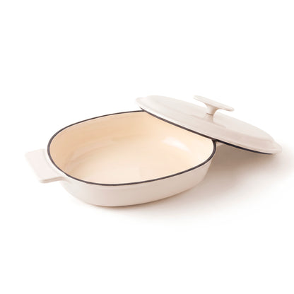 Enamelled cast iron oval casserole with lid - cream
