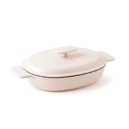 Enamelled cast iron oval casserole with lid - cream